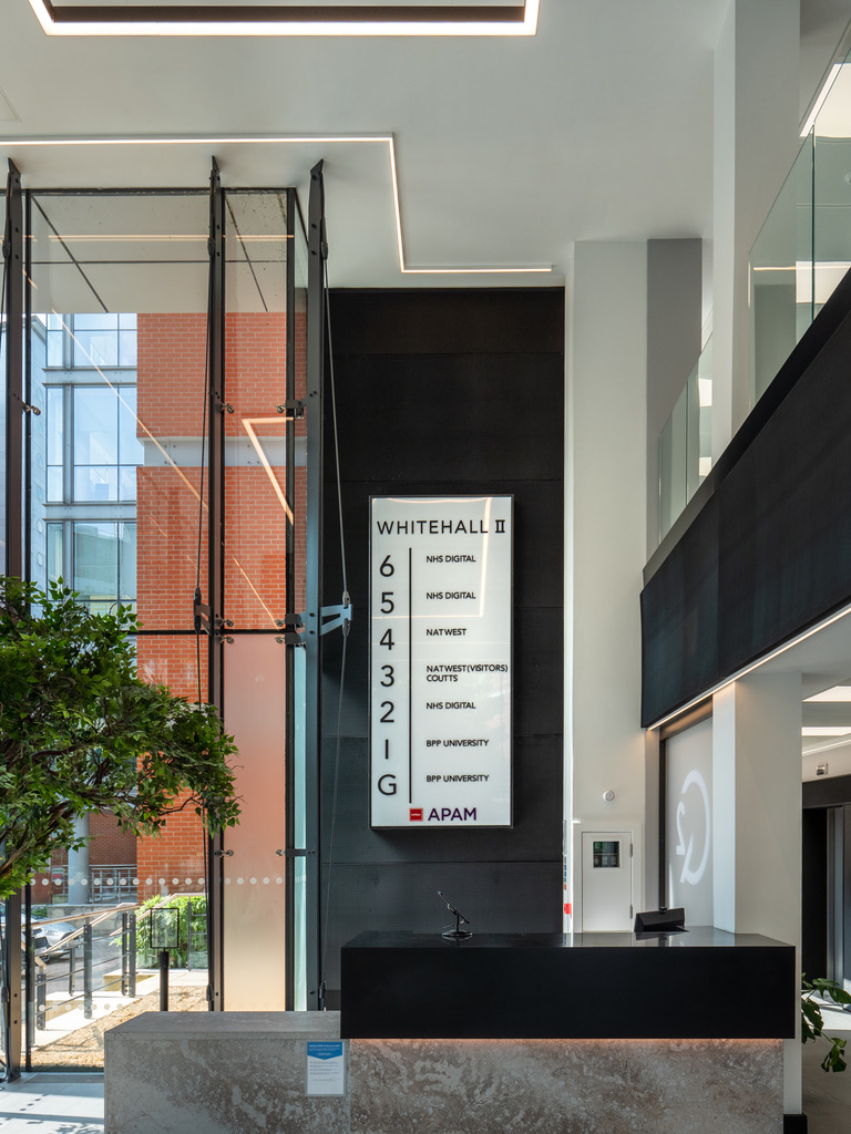2 Whitehall Quay — reception desk and directory board with linear LED ceiling detail