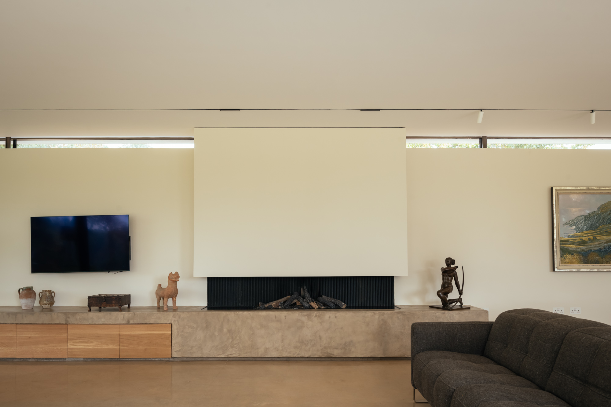 Clayworth interior — open plan living with layered lighting scheme