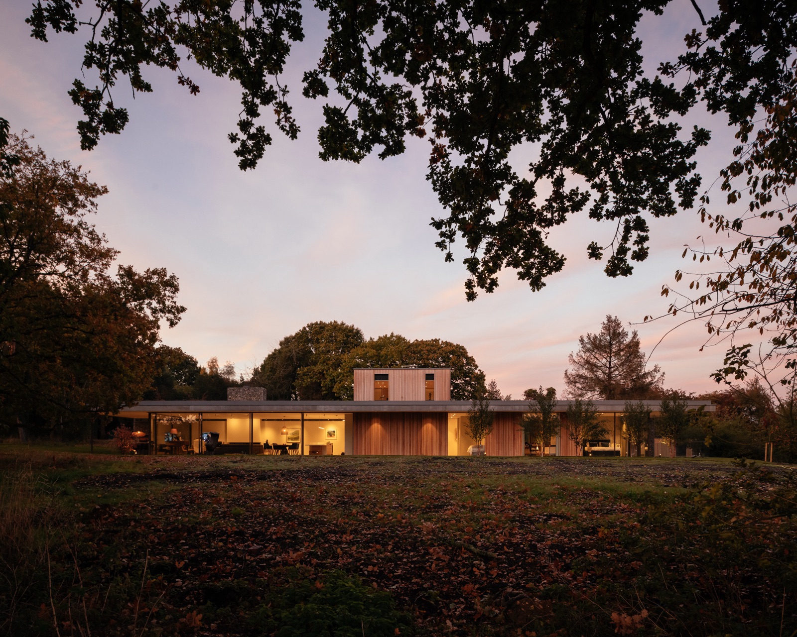 Clayworth — exterior view at dusk with Aqform garden lighting